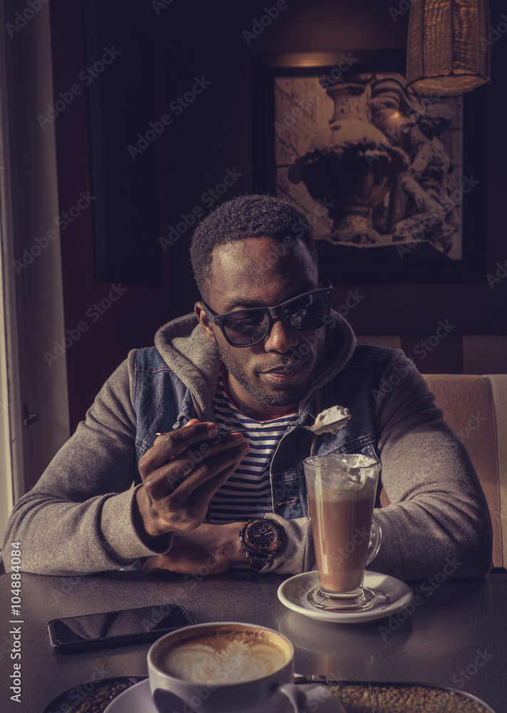 Blackman in sunglasses drinking coffee. Blackman in sunglasses drinking coffee.