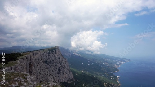 The formation of clouds between the mountains and the sea. Black Sea. Summer.Timelapse