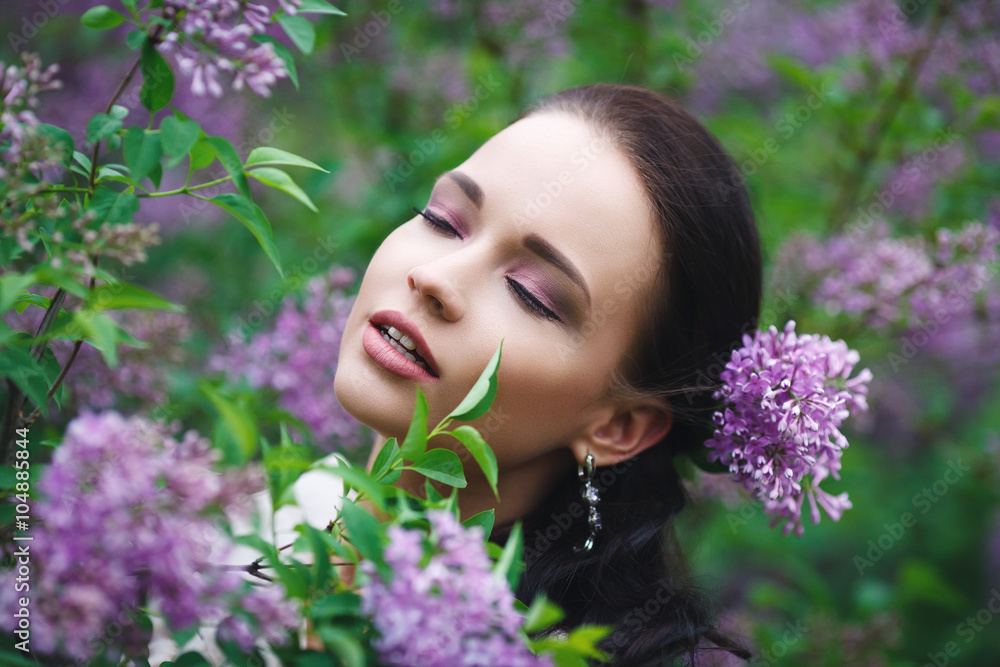 Beautiful girl in a park with flowers tree Beautiful girl in a park with flowers tree