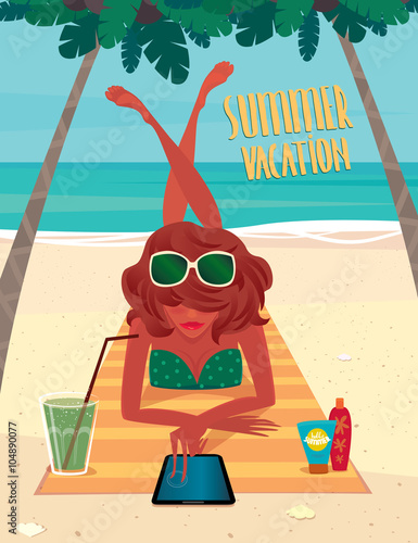 Girl sunbathing on a beach mat on the beach and using a tablet - Beach holidays concept