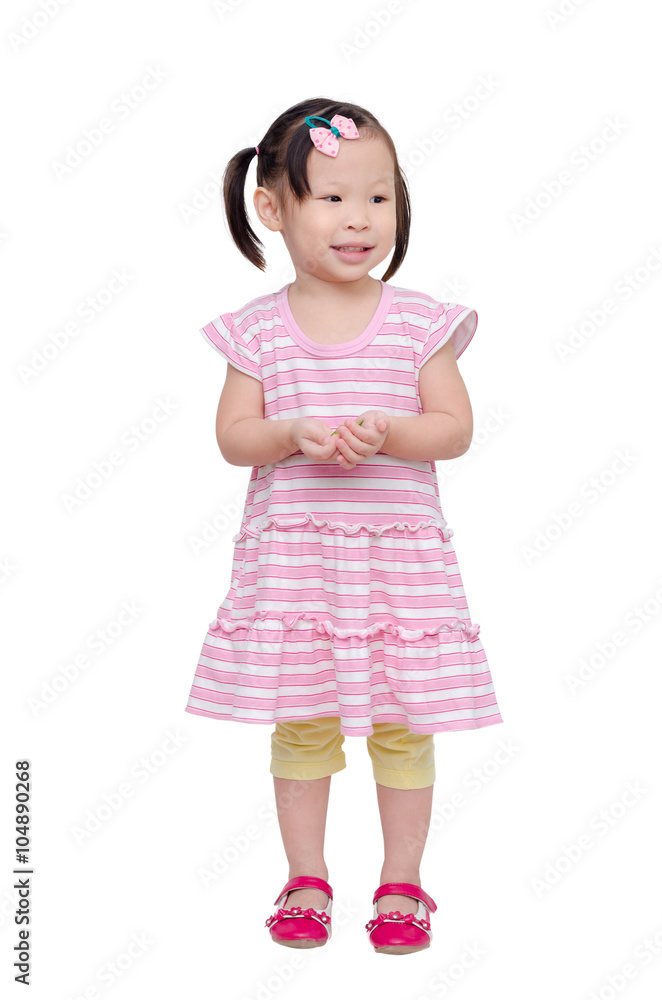 Little asian girl standing and smiles over white Little asian girl standing and smiles over white