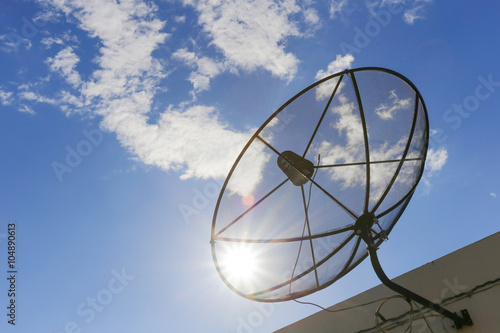 Satellite dish to the sky in blue sky background with tiny cloud