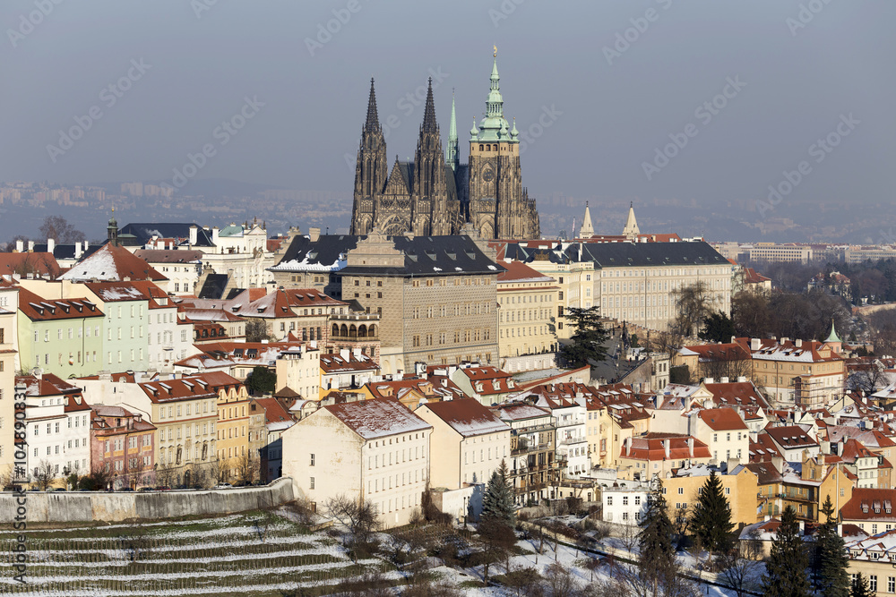 Romantic snowy  Prague City with gothic Castle, Czech Republic