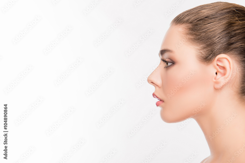 Side view portrait of attractive woman's face on white backgroun Stock
