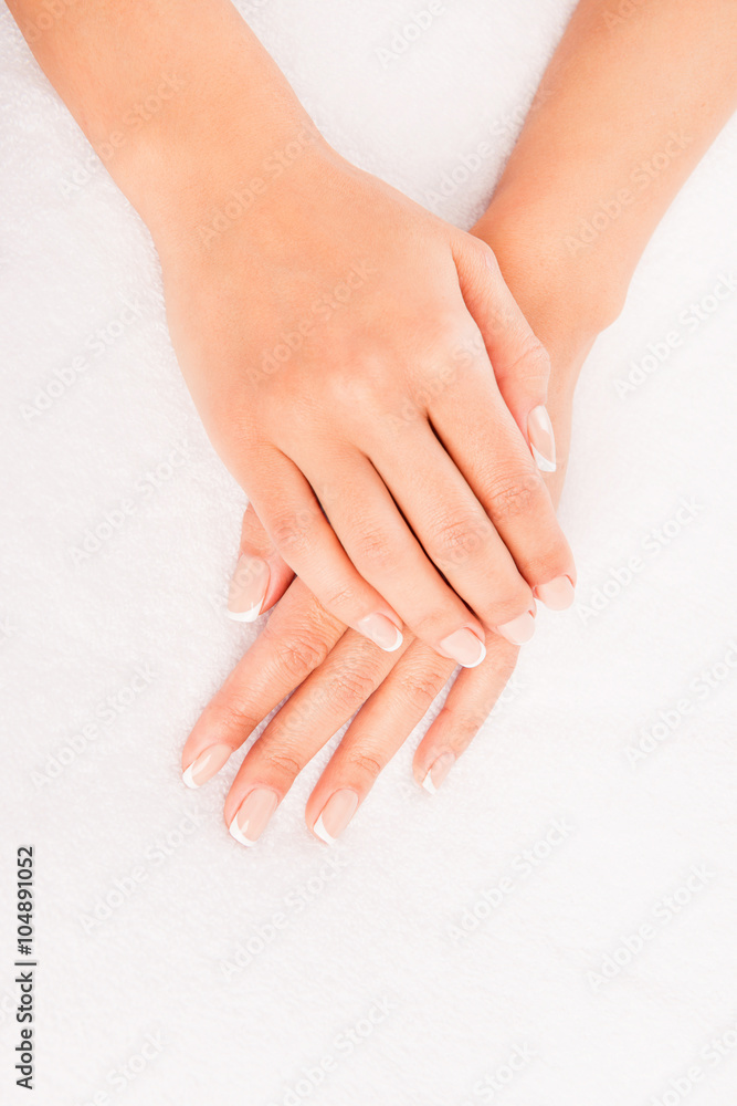 Close up photo of woman's hand with manicure on white background