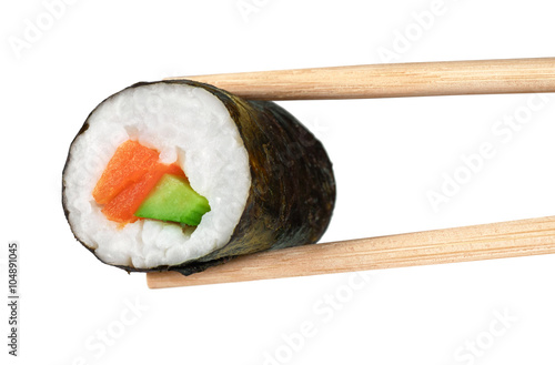 Sushi rolls with avocado and salmon. Chopsticks.