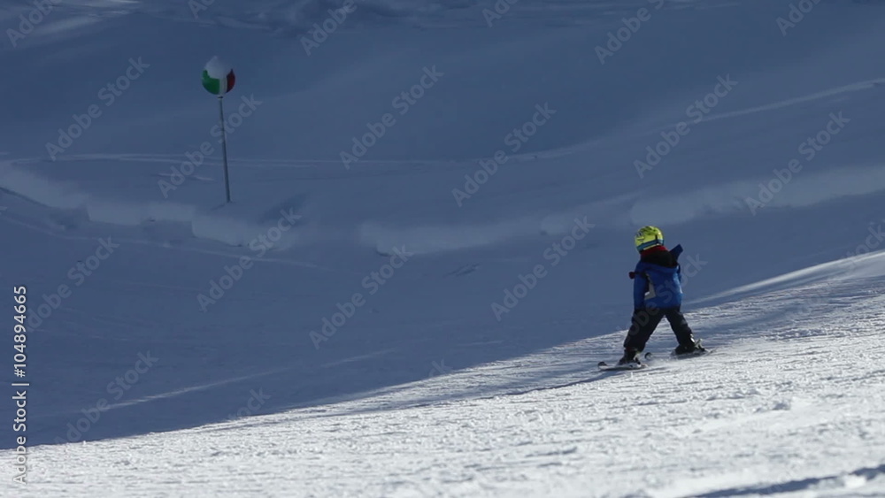 Young family, father and child, skiing in Austrian resort, wintertime Young family, father and child, skiing in Austrian resort, wintertime