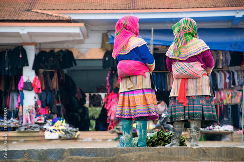 Hmong women at Bac Ha market in Northern Vietnam. Bac Ha is hilltribe market where people come to trade for goods in traditional costumes