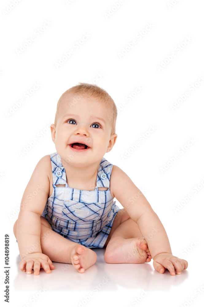 Baby is sitting on floor, isolated on white Baby is sitting on floor, isolated on white