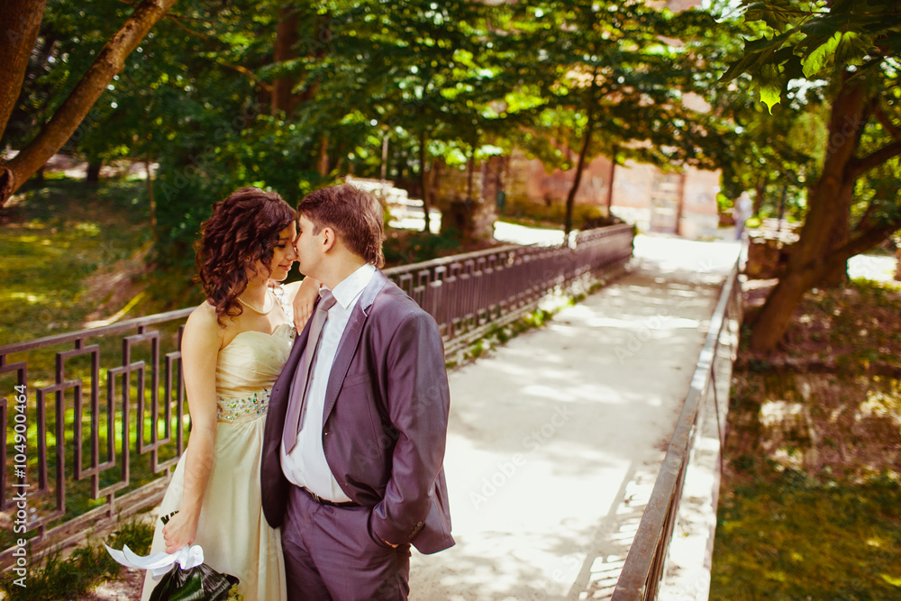 Happy newlywed romantic couple walking in the park Happy newlywed romantic couple walking in the park