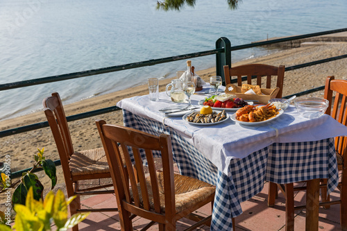Fototapeta Naklejka Na Ścianę i Meble -  Dinner in a fish restaurant