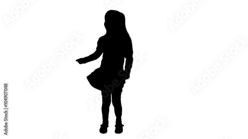 Silhouette of a girl who dances.