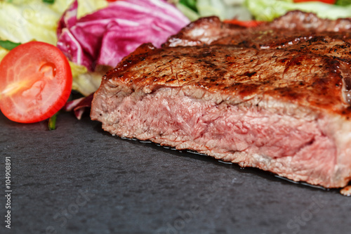 Roasted steak on slate plate
