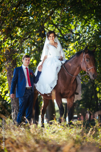 Wedding walk on nature with horses