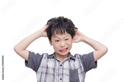 Young Asian boy scratching his scalp over white