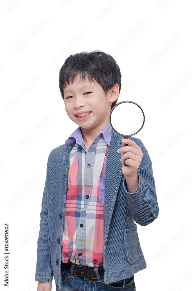Young Asian boy with magnifying glass over white Young Asian boy with magnifying glass over white