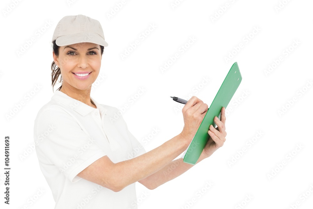 Delivery woman signing a clipboard Delivery woman signing a clipboard