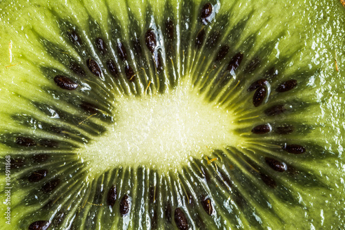 Obraz na płótnie Slice of kiwi macro background texture.