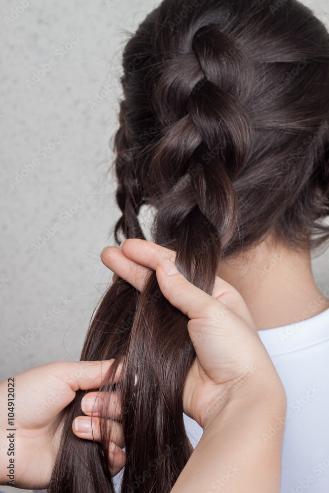 Fototapeta premium weave braid girl in a hair salon