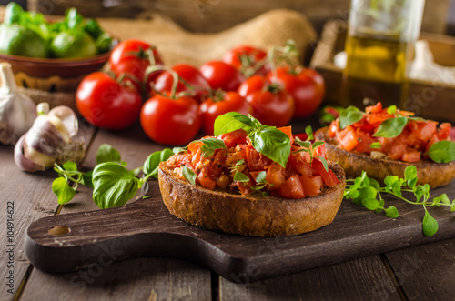 Italian bruschetta with roasted tomatoes and garlic photo