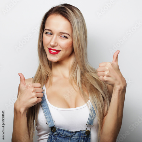 Happy woman giving thumb up