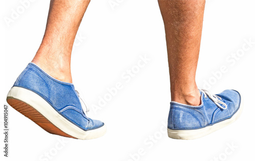 Walking man with blue shoes