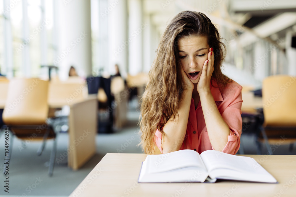 Female student studying in library Female student studying in library