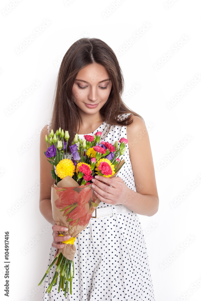 Pretty beautiful girl holding bunch of flowers Pretty beautiful girl holding bunch of flowers