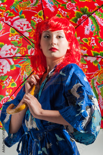 young lady with red hair and colorful umbrella 
