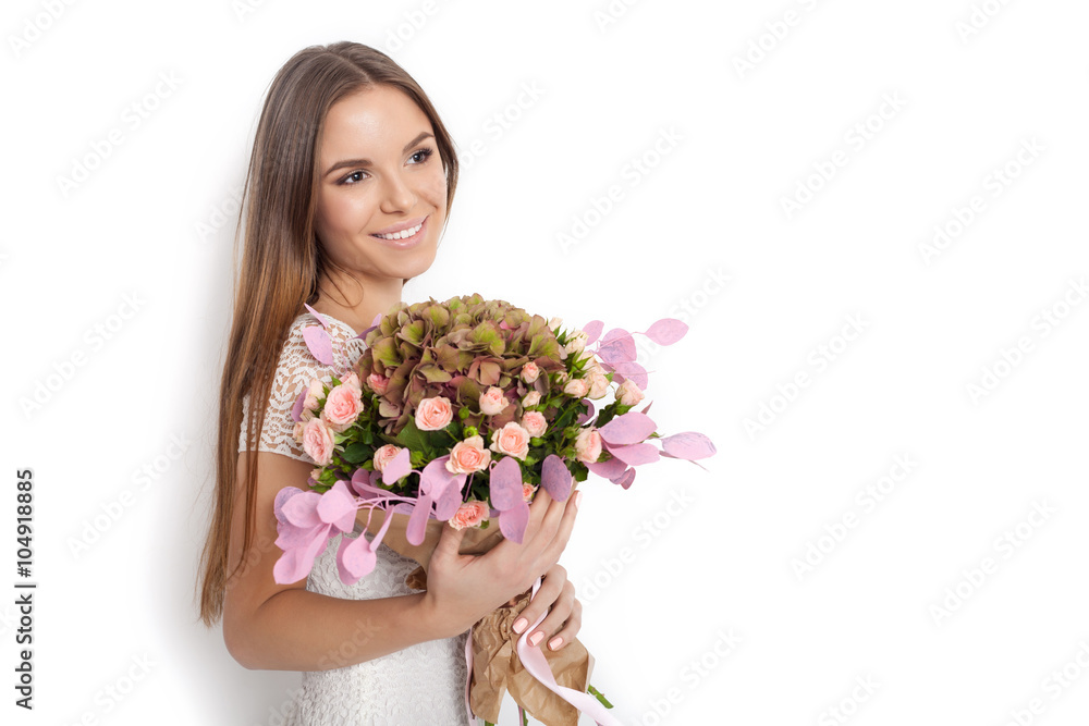 Young cute woman holding bunch of flowers Young cute woman holding bunch of flowers