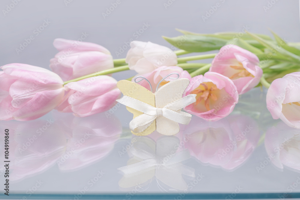 Fototapeta premium Pink tulips and butterfly decoration 