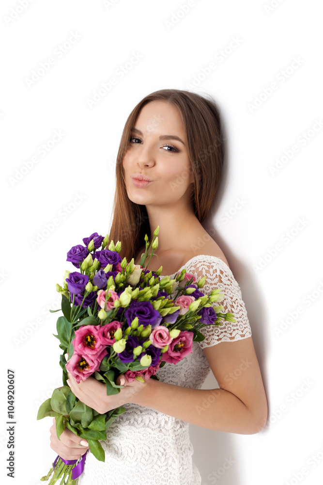 Young cute woman holding Bouquet of flowers