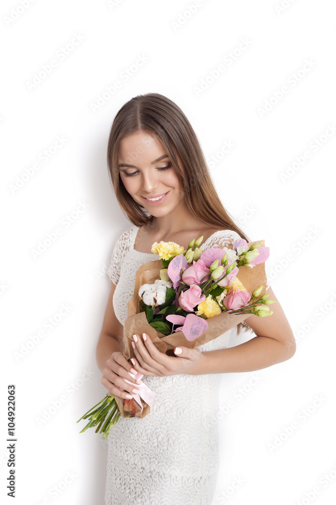 Young cute woman holding bunch of flowers Young cute woman holding bunch of flowers