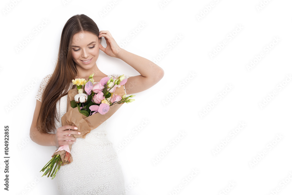 Young cute woman holding bunch of flowers