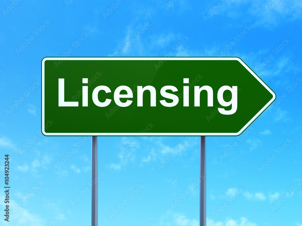 Obraz premium Law concept: Licensing on road sign background