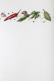 Herbs and spices on white wooden background. Space for text