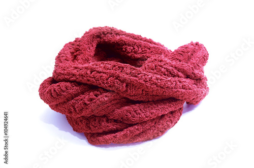 Warm knitted red scarf isolated on white background