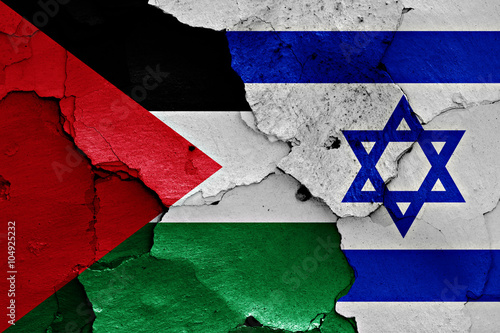 flags of Palestine and Israel painted on cracked wall