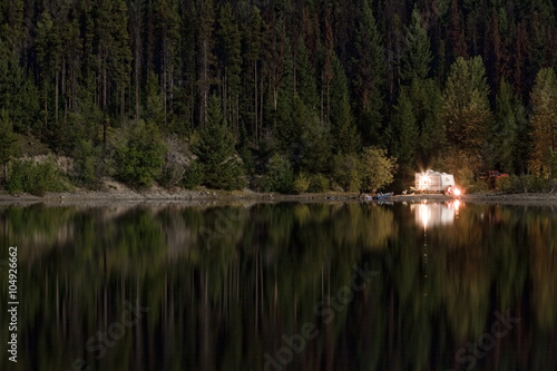 caravan for camping at night in wilderness