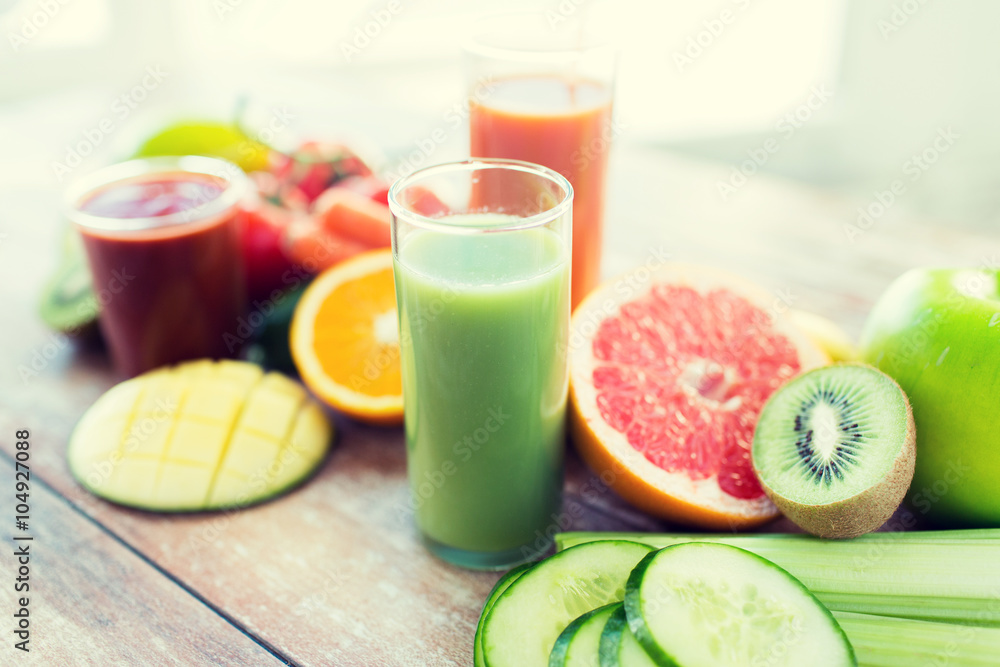 close up of fresh juice glass and fruits on table close up of fresh juice glass and fruits on table
