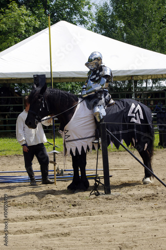 Medieval knight in armor on horse