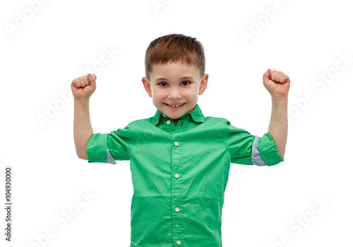 happy smiling little boy with raised hand
