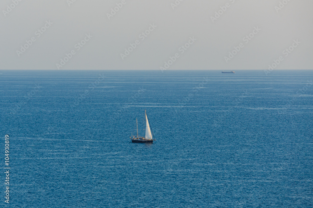 view of the lonely sail in the sea