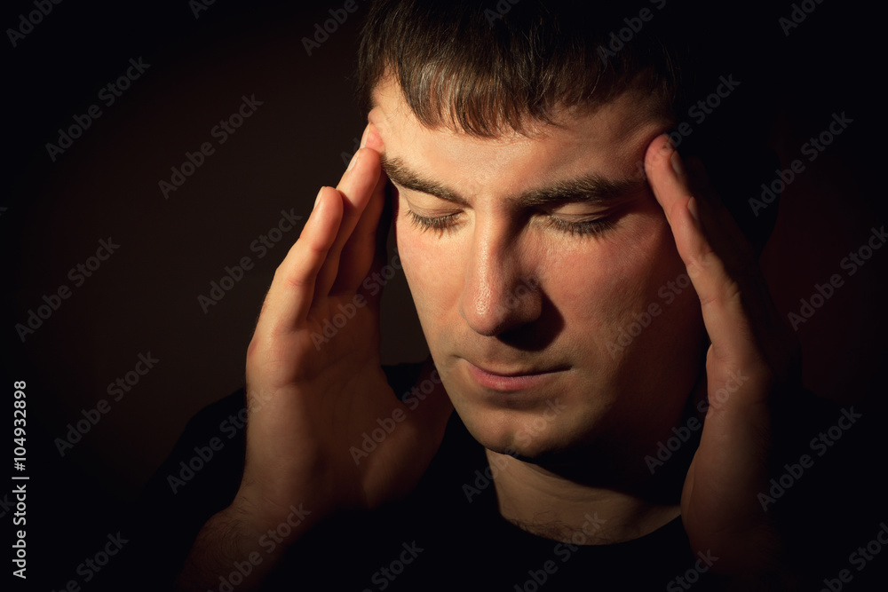 Man having a migraine headache. Man having a migraine headache.