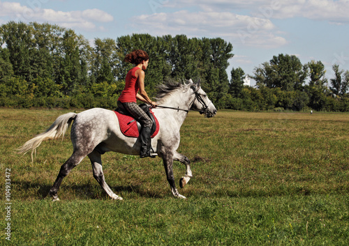Young pretty women galloping horseback © horsemen