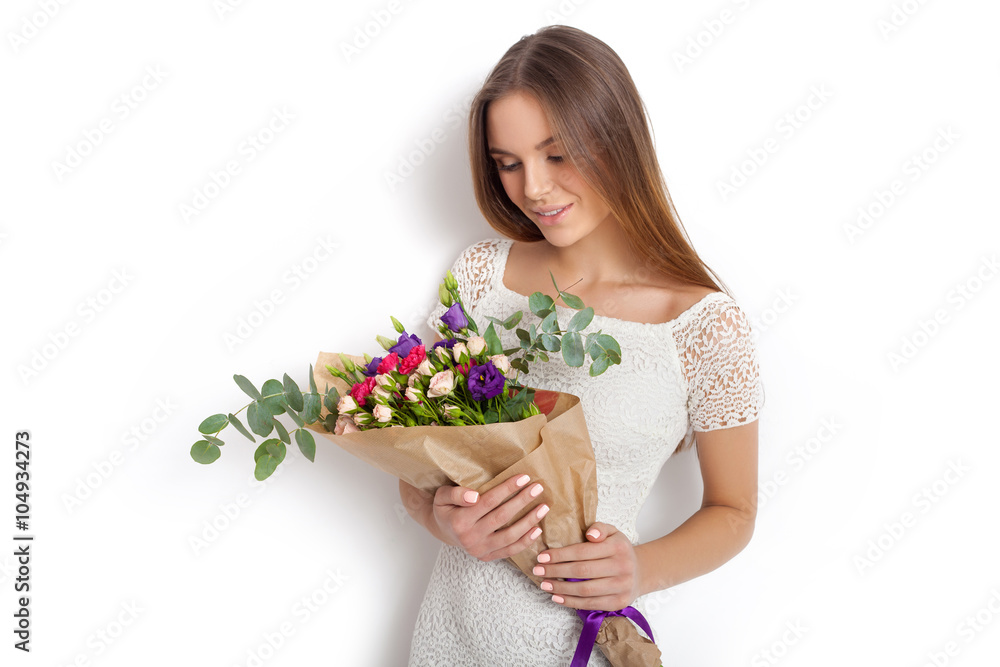 Young cute woman with spring flower bouquet Young cute woman with spring flower bouquet