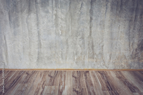 cement mortar wall background and wood floor in the room