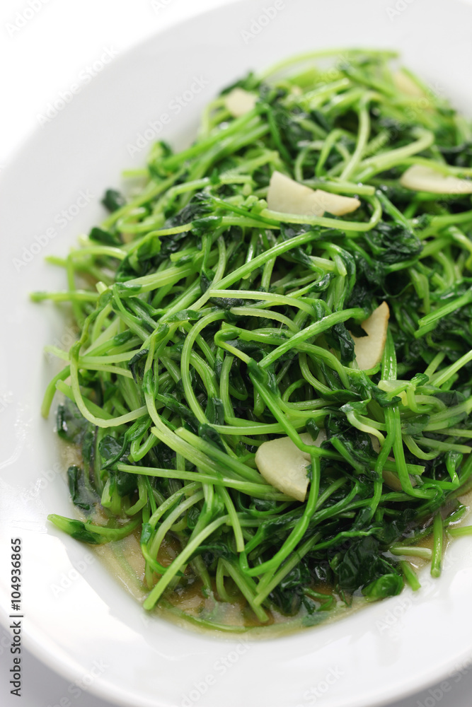 stir fried pea shoots with garlic, chinese cuisine stir fried pea shoots with garlic, chinese cuisine