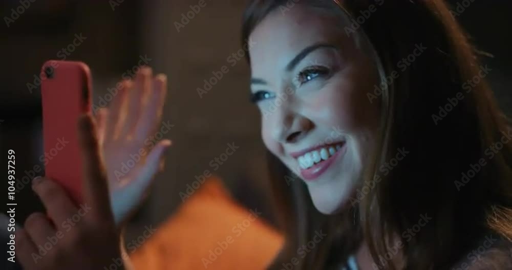 Beautiful asian woman having late night video chat with friend using digital tablet Beautiful asian woman having late night video chat with friend using digital tablet