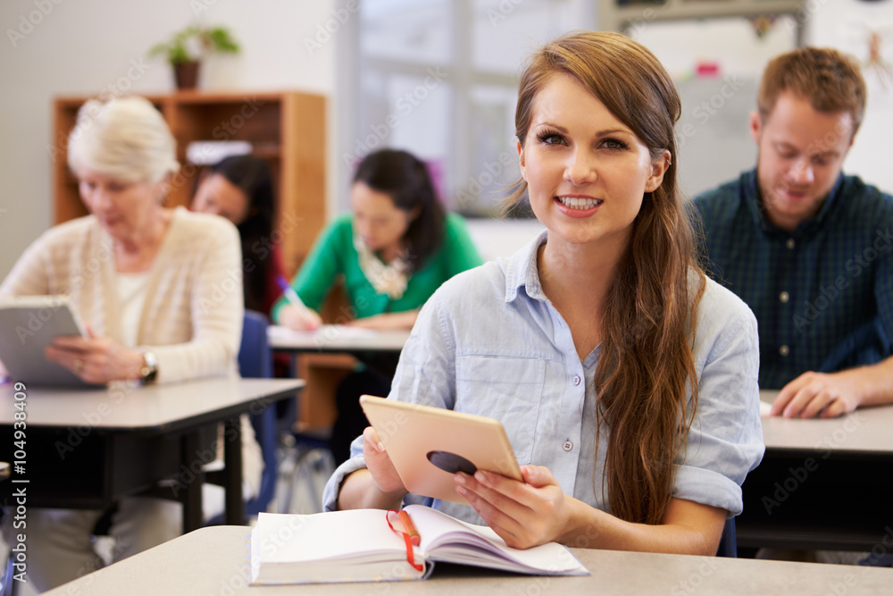Fototapeta premium Young woman at adult education class looking to camera